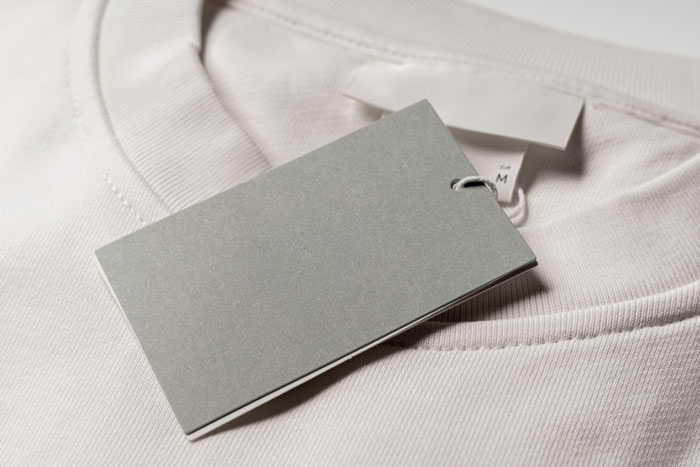 Blank gray hang tag and white shirt tags