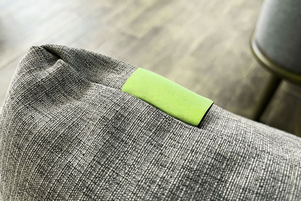 Close up of a blank green furniture tag